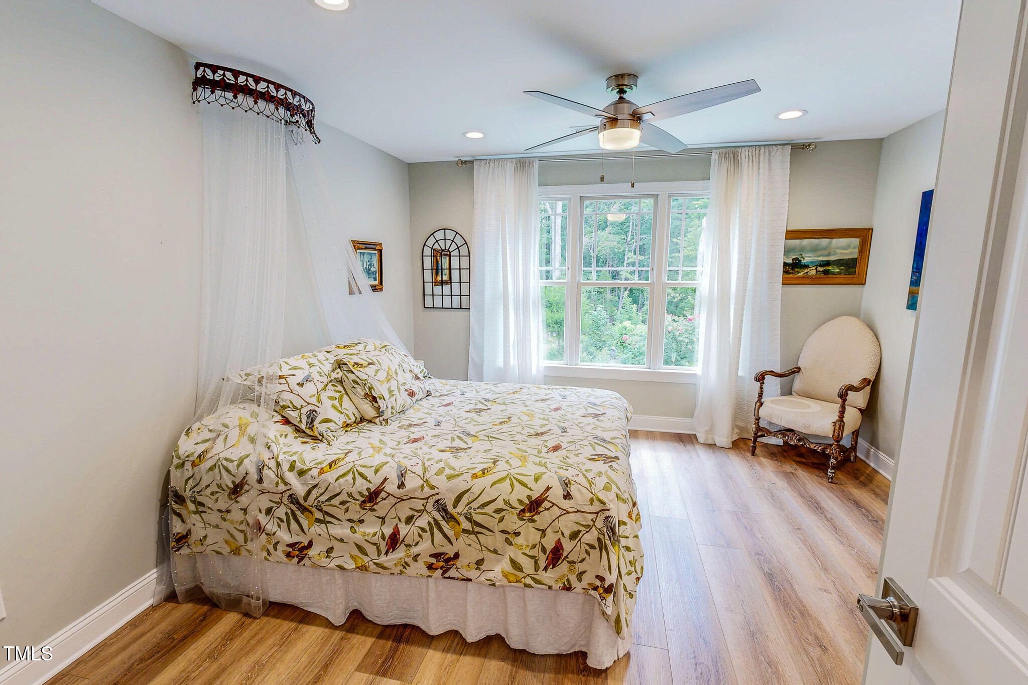 355 Fishermans Point Road Roxboro, NC 27574 - Photo 57 of 70 a bedroom with a bed a table and a large window