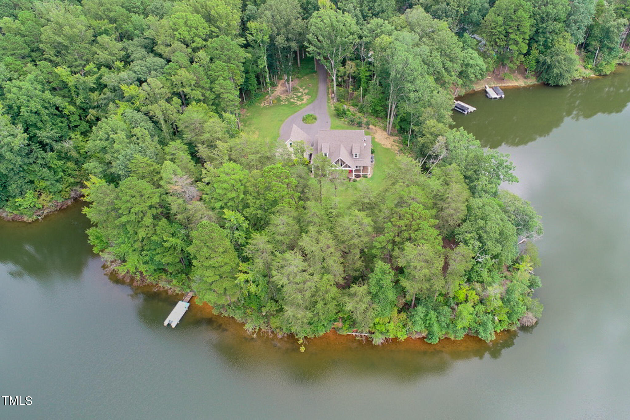 355 Fishermans Point Road Roxboro, NC 27574 - Photo 6 of 70 an aerial view of a house with a yard and lake view