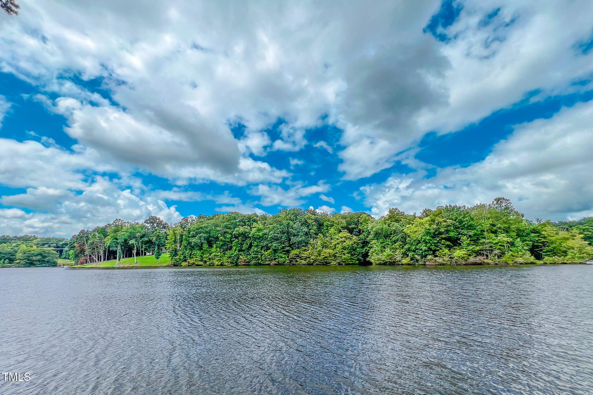 355 Fishermans Point Road Roxboro, NC 27574 - Photo 67 of 70 a view of a lake with a big yard