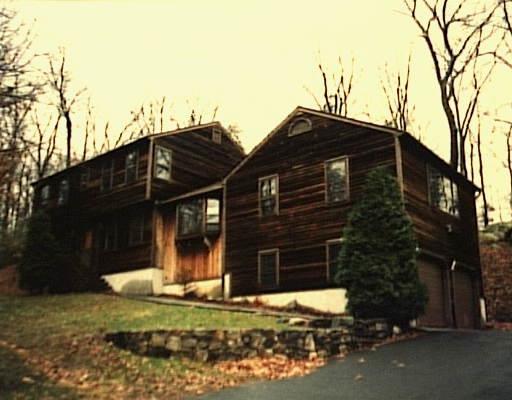 77 Riverside Road Newtown, CT 06482 - Photo 1 of 1 a front view of a house