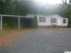 161 Sedberry Road Biscoe, NC 27209 - Photo 1 of 7 a view of a house with backyard