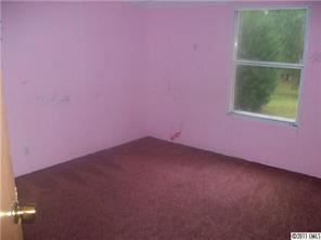 161 Sedberry Road Biscoe, NC 27209 - Photo 6 of 7 an empty room with a window
