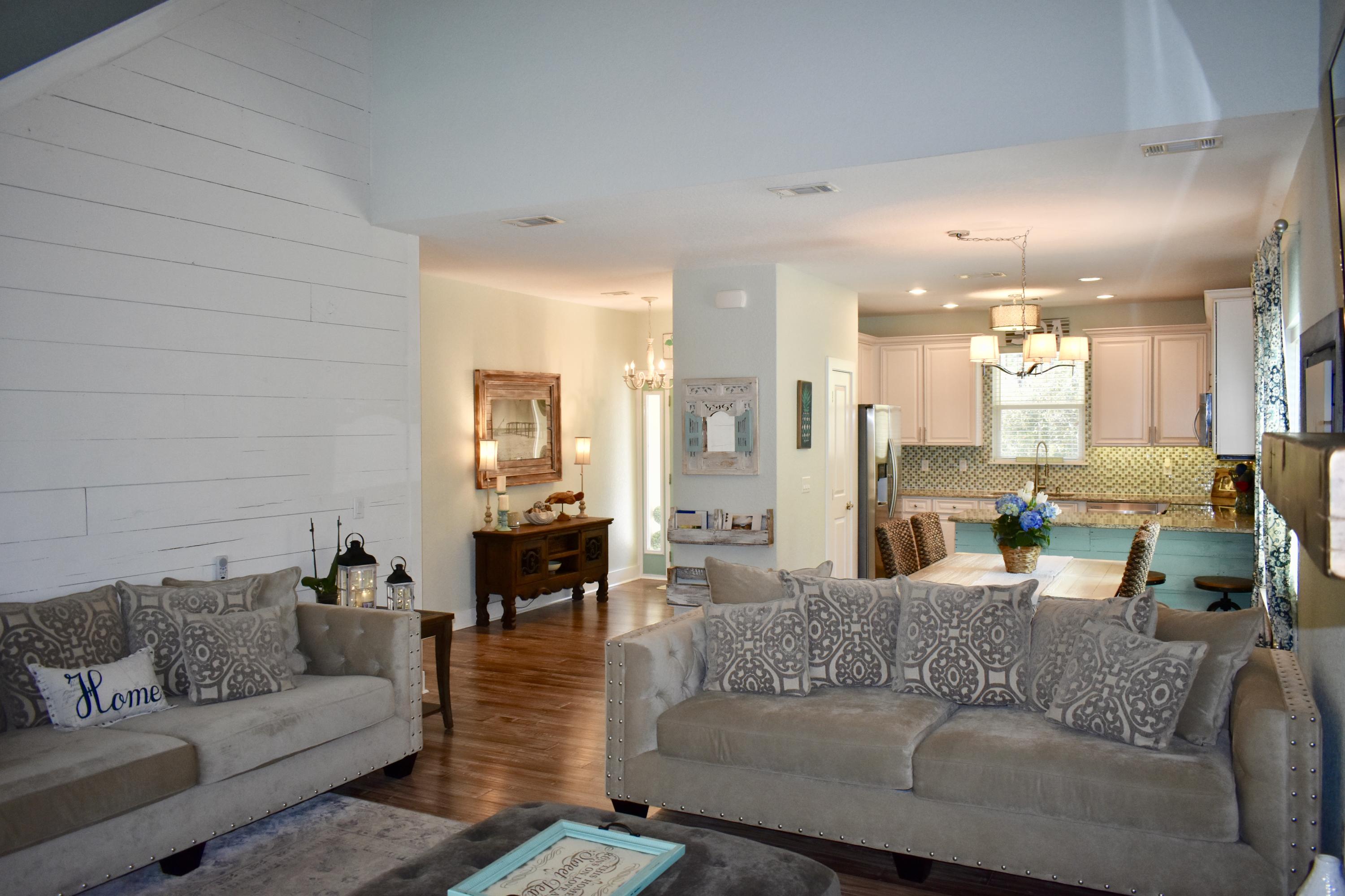 153 Spotted Dolphin Road Santa Rosa Beach, FL 32459 - Photo 11 of 36 a living room with furniture and a large window