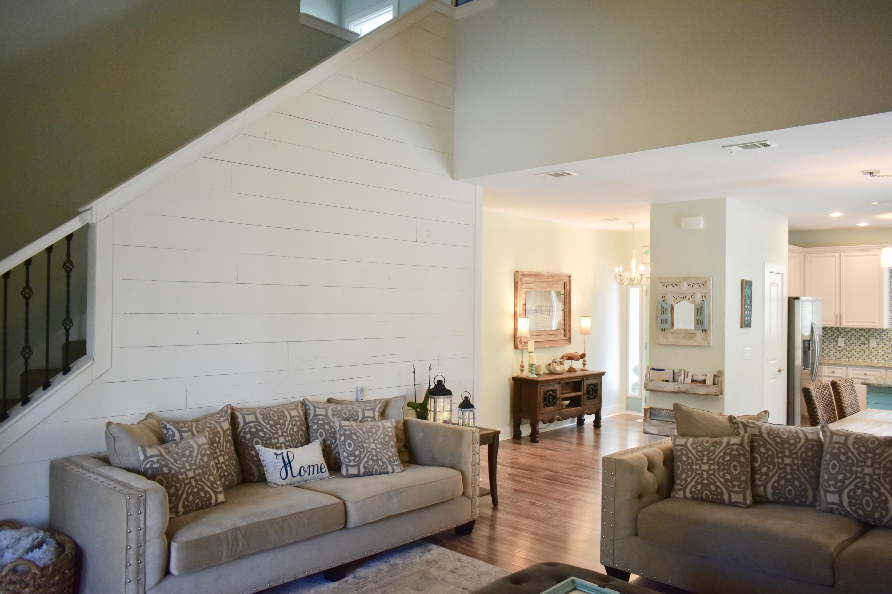 153 Spotted Dolphin Road Santa Rosa Beach, FL 32459 - Photo 12 of 36 a living room with furniture and a large window