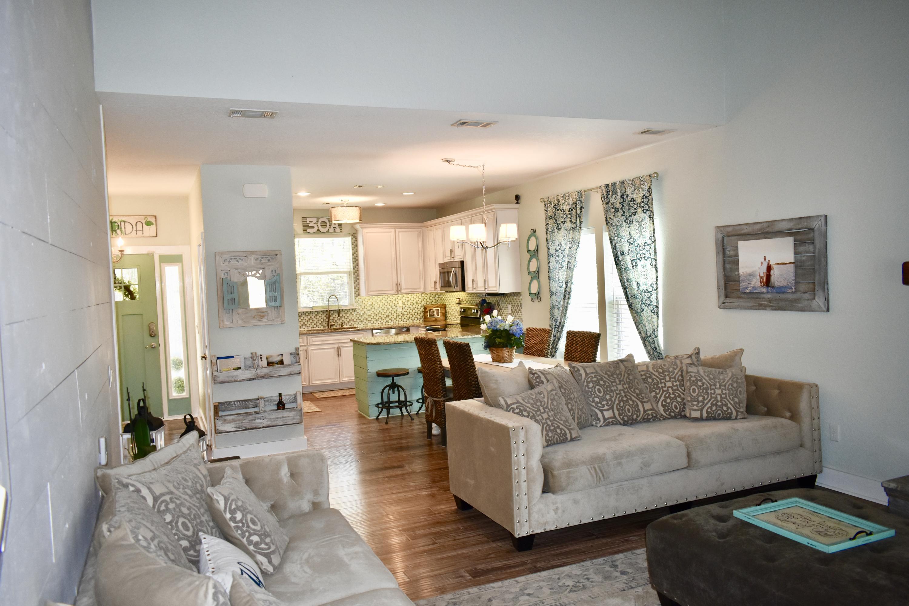 153 Spotted Dolphin Road Santa Rosa Beach, FL 32459 - Photo 13 of 36 a living room with furniture and a large window