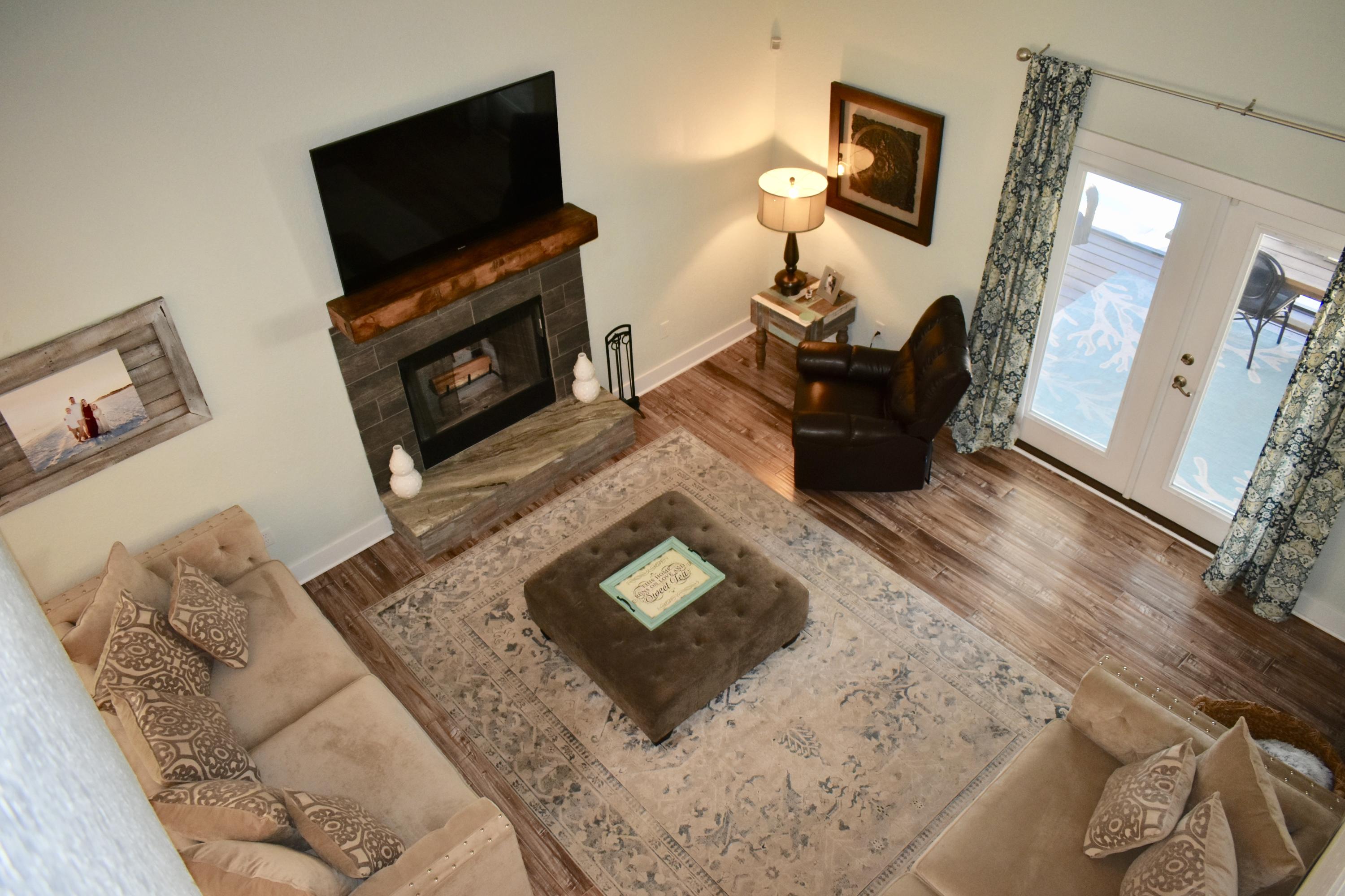 153 Spotted Dolphin Road Santa Rosa Beach, FL 32459 - Photo 16 of 36 a living room with furniture and a flat screen tv