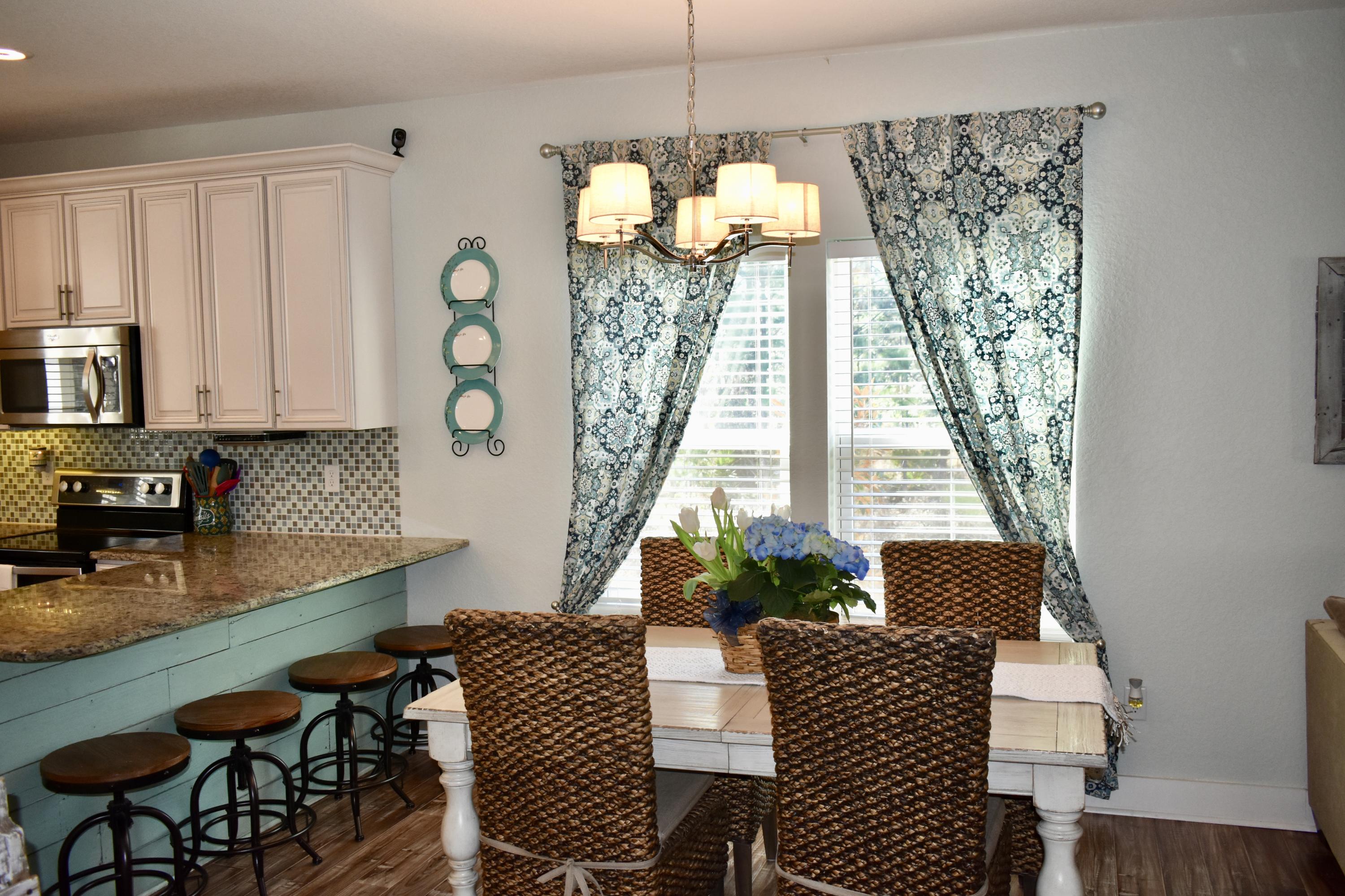 153 Spotted Dolphin Road Santa Rosa Beach, FL 32459 - Photo 18 of 36 a dining room with furniture and window