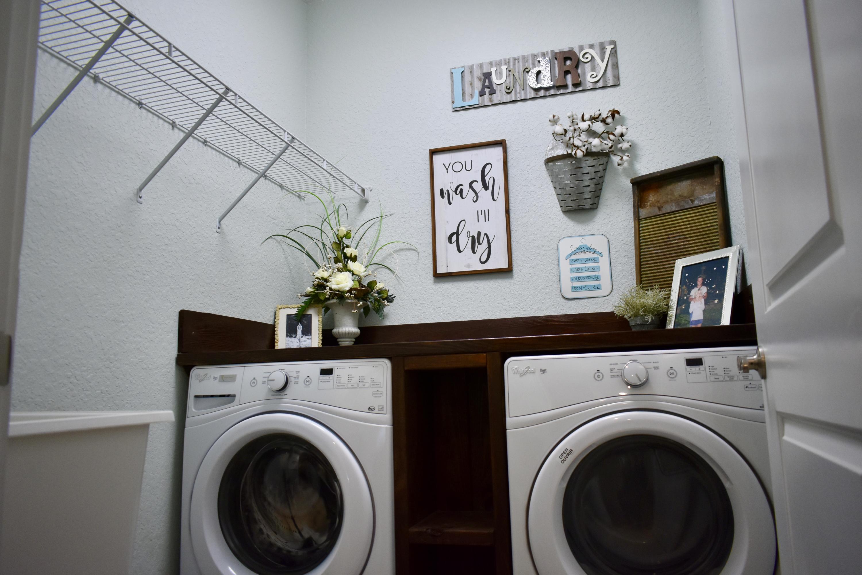 153 Spotted Dolphin Road Santa Rosa Beach, FL 32459 - Photo 19 of 36 a view of a utility room with dryer on the wall
