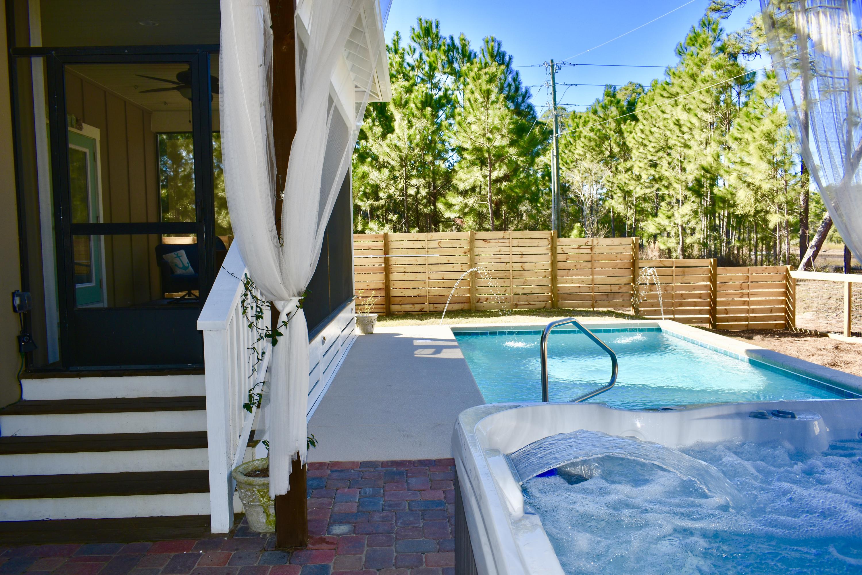 153 Spotted Dolphin Road Santa Rosa Beach, FL 32459 - Photo 2 of 36 a view of outdoor space deck and kitchen