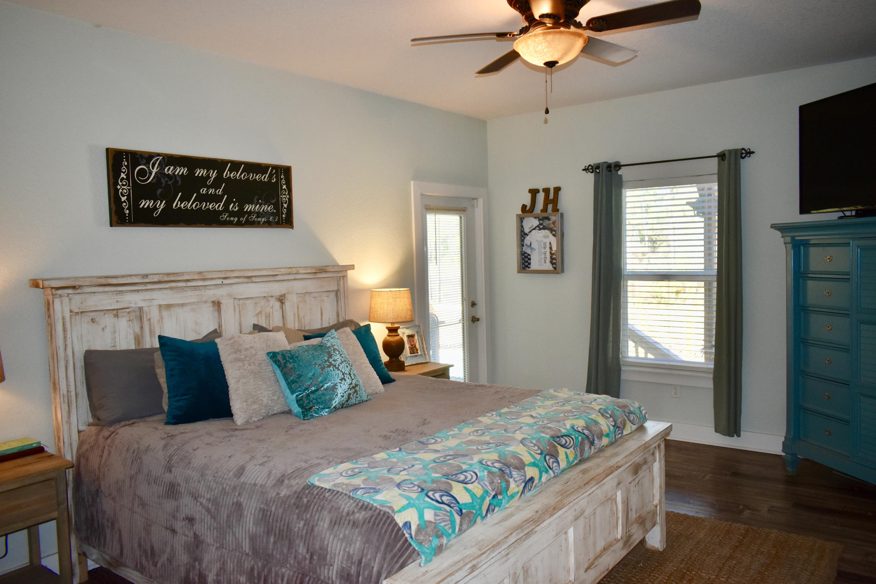153 Spotted Dolphin Road Santa Rosa Beach, FL 32459 - Photo 21 of 36 a bedroom with a bed and a television