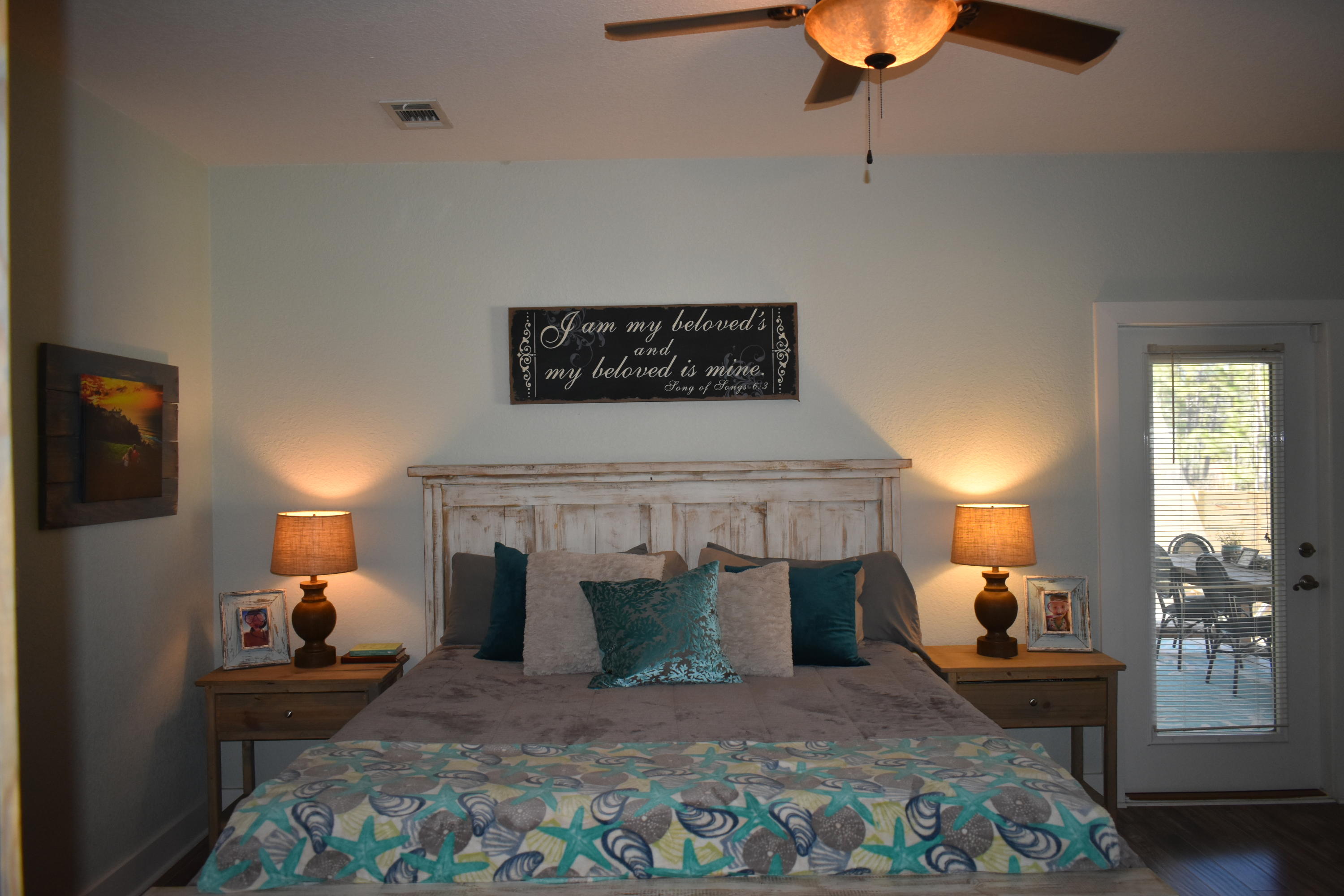 153 Spotted Dolphin Road Santa Rosa Beach, FL 32459 - Photo 23 of 36 a bedroom with a bed and wooden floor