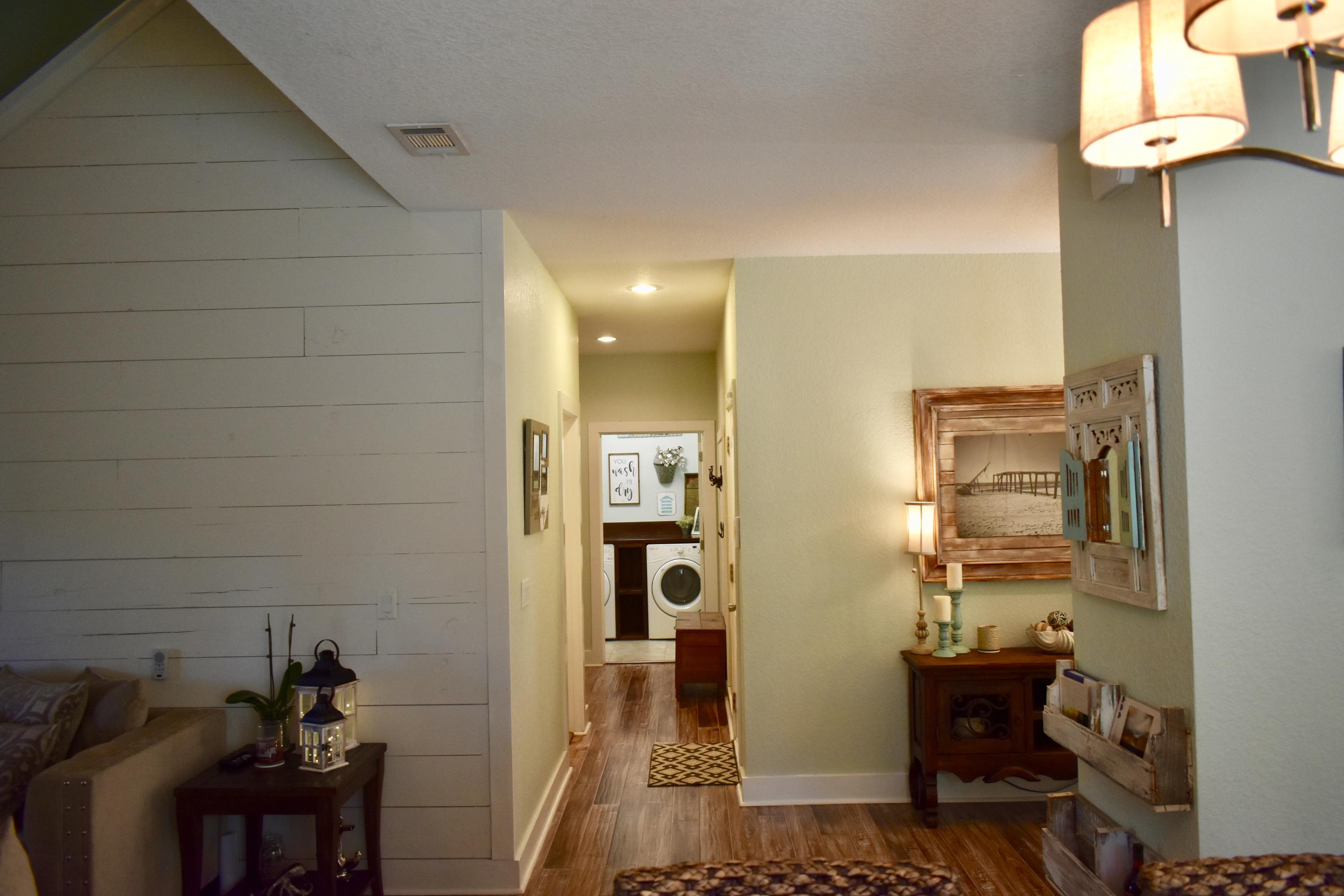 153 Spotted Dolphin Road Santa Rosa Beach, FL 32459 - Photo 26 of 36 a view of a hallway with seating area