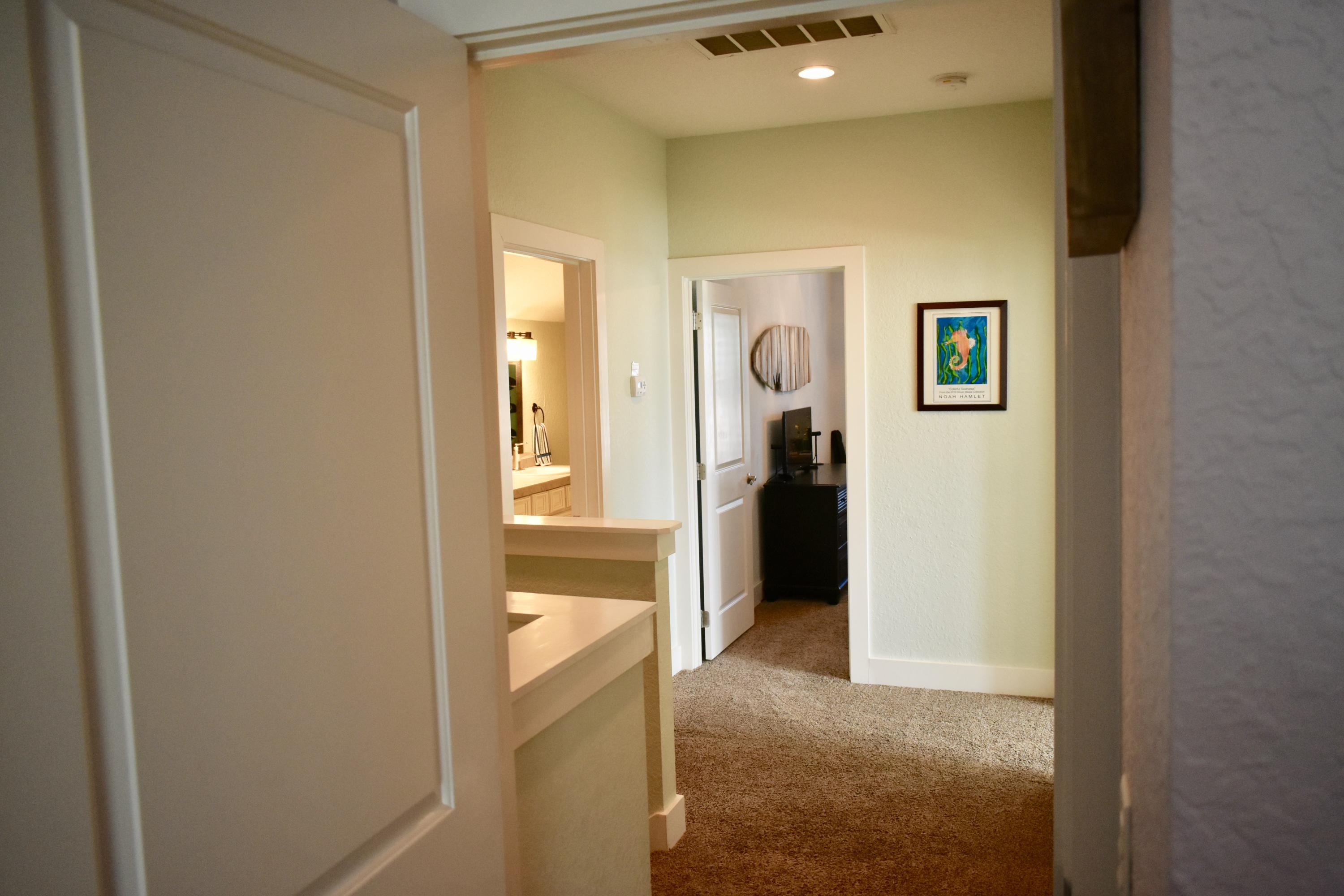 153 Spotted Dolphin Road Santa Rosa Beach, FL 32459 - Photo 27 of 36 a view of a hallway with wooden shelves