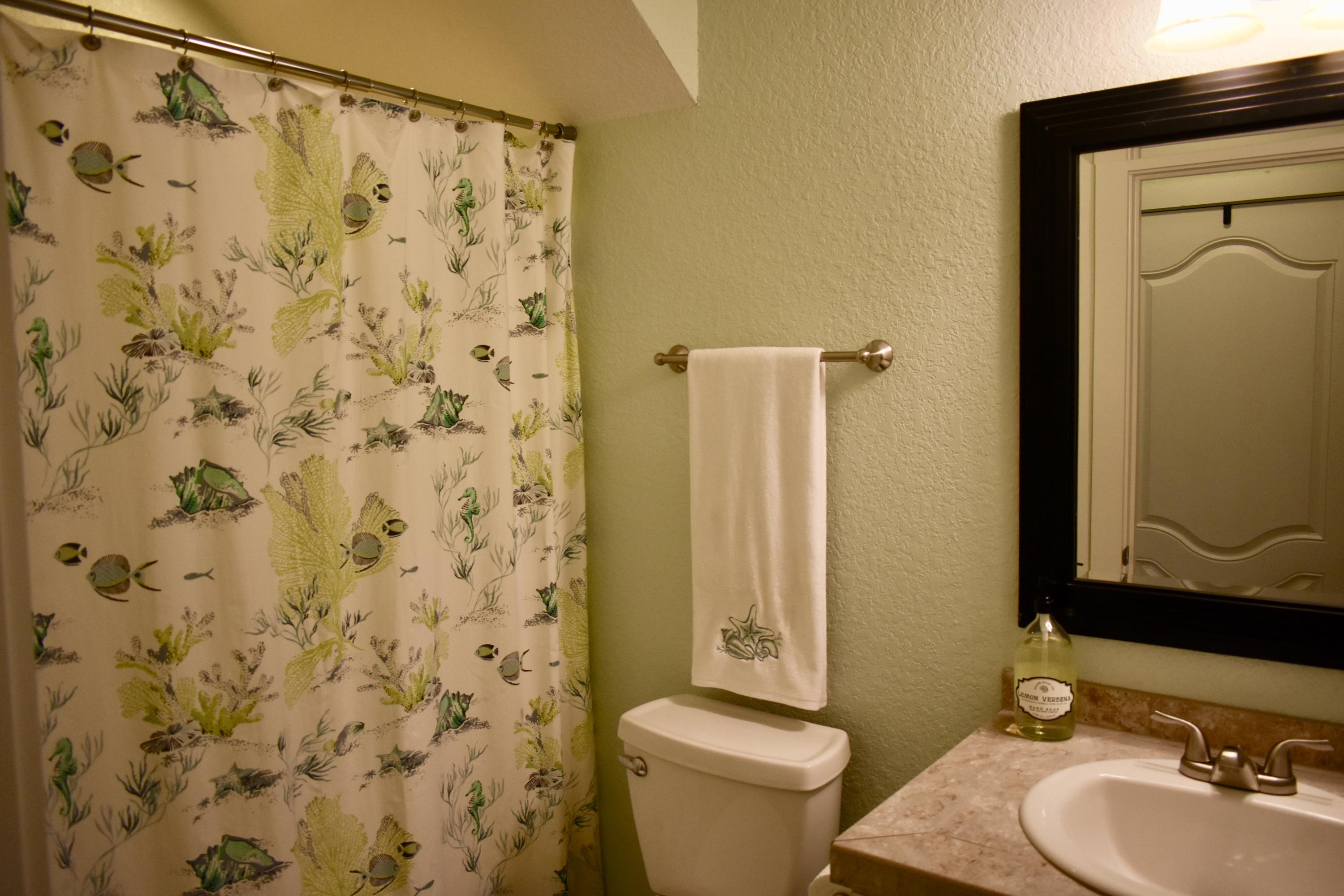 153 Spotted Dolphin Road Santa Rosa Beach, FL 32459 - Photo 32 of 36 a bathroom with a sink and a mirror