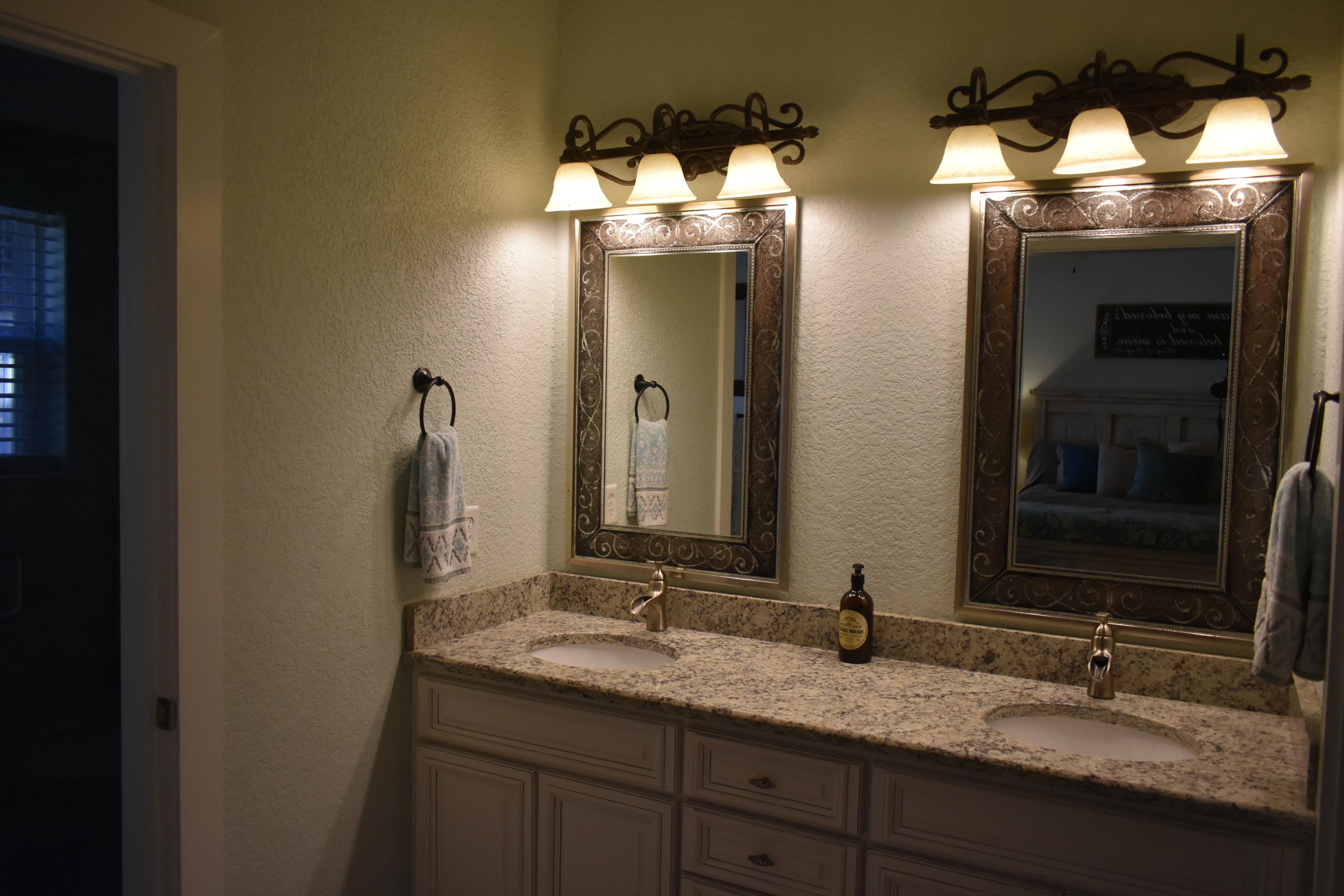 153 Spotted Dolphin Road Santa Rosa Beach, FL 32459 - Photo 34 of 36 a bathroom with a double vanity sink and a mirror