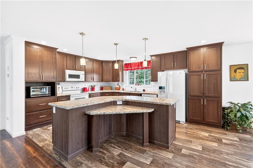 100 Linden Monongahela, PA 15063 - Photo 6 of 41 Spacious 20x13 Eat-in Kitchen w/ Plenty of Cabinetry plus a Built-in Pantry in addition to Storage in Island! All Appliances Included in Sale!