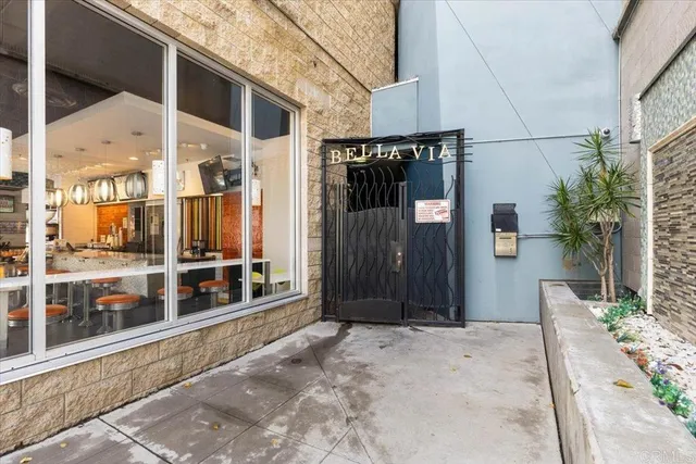 a view of a house with a wooden fence