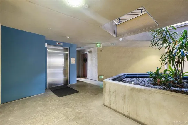 a view of kitchen and empty room