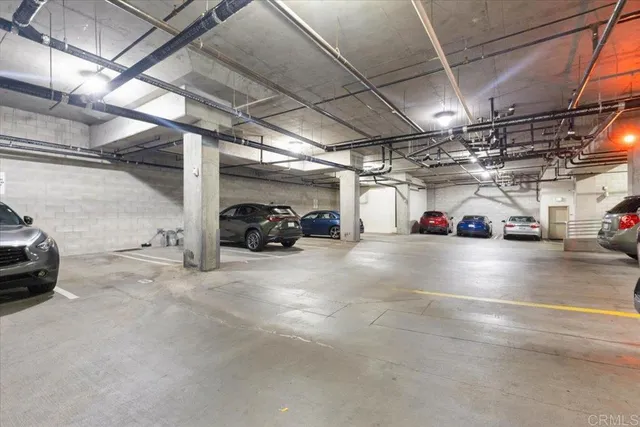 a view of parking space with parked cars