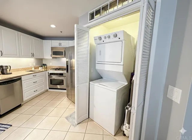 a kitchen with a stove a sink and a refrigerator