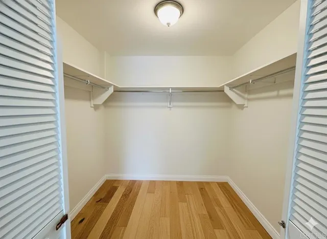 a view of an empty walk in closet