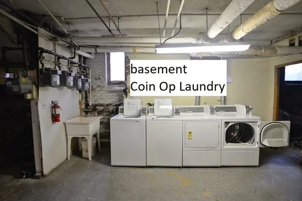 a kitchen with a sink a stove and cabinets