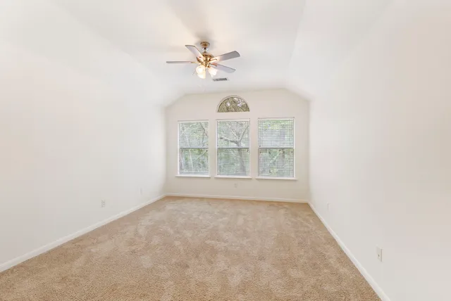 a bathroom with a tub sink and a mirror
