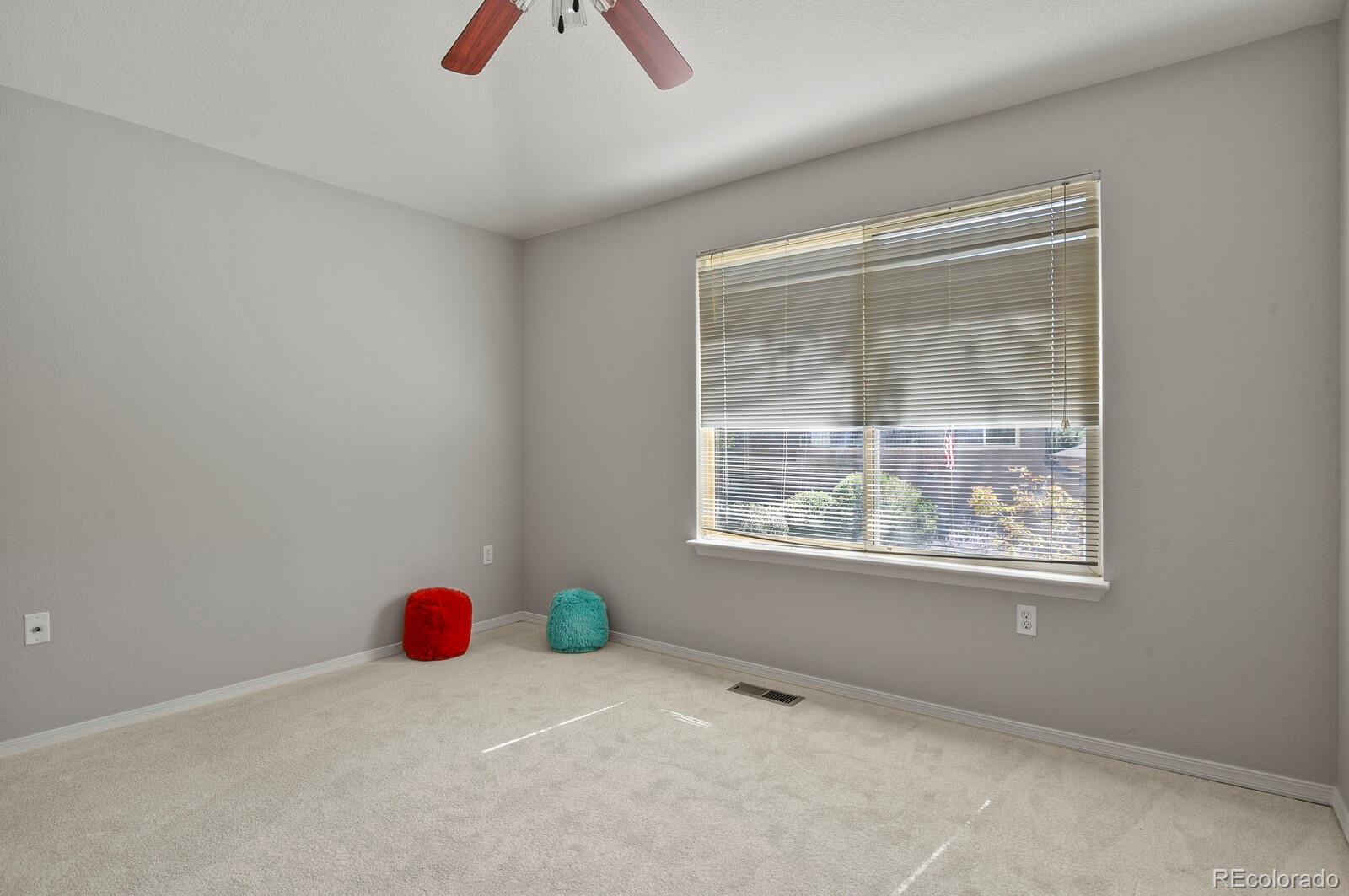 6444 Silver Mesa Drive, Unit A Highlands Ranch, CO 80130 - Photo 17 of 40 an empty room with windows and closet