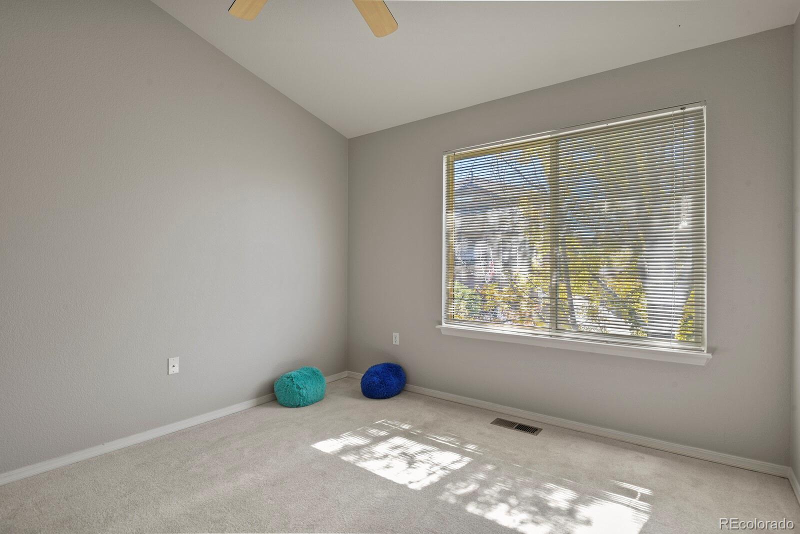 6444 Silver Mesa Drive, Unit A Highlands Ranch, CO 80130 - Photo 20 of 40 an empty room with windows