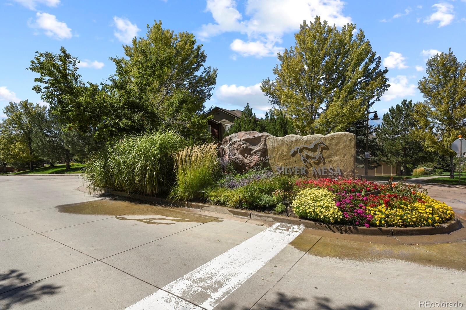 6444 Silver Mesa Drive, Unit A Highlands Ranch, CO 80130 - Photo 23 of 40 a view of a street with some trees