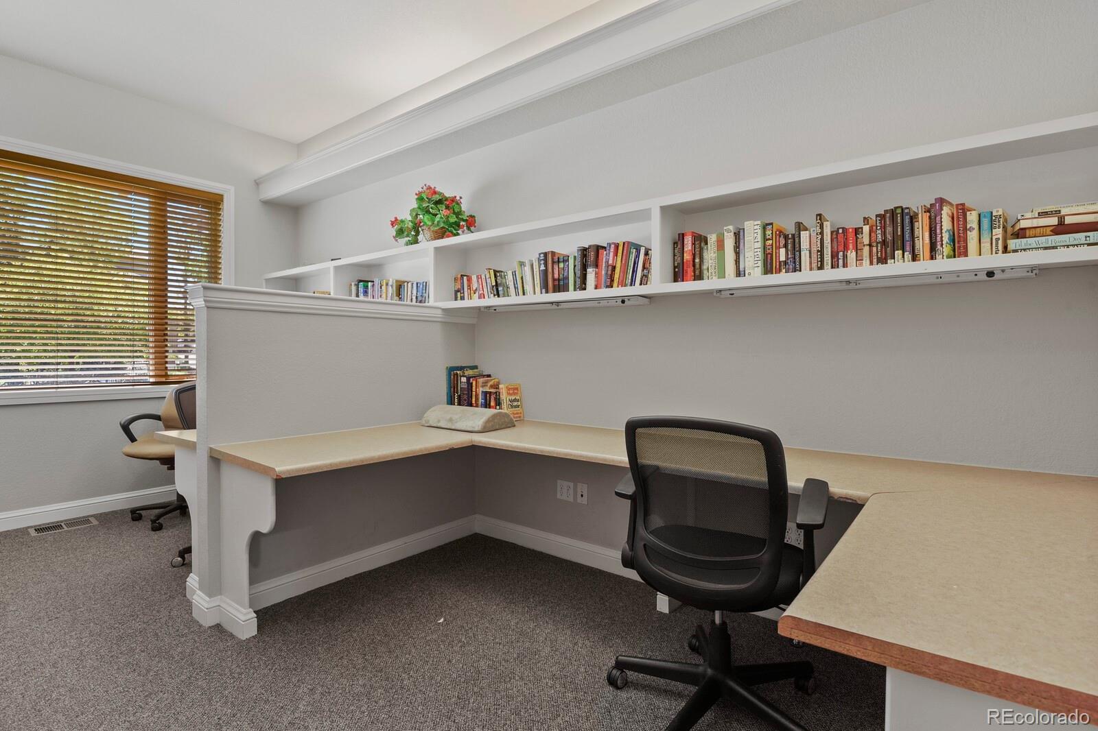 6444 Silver Mesa Drive, Unit A Highlands Ranch, CO 80130 - Photo 33 of 40 a workspace with a desk chair and cabinet
