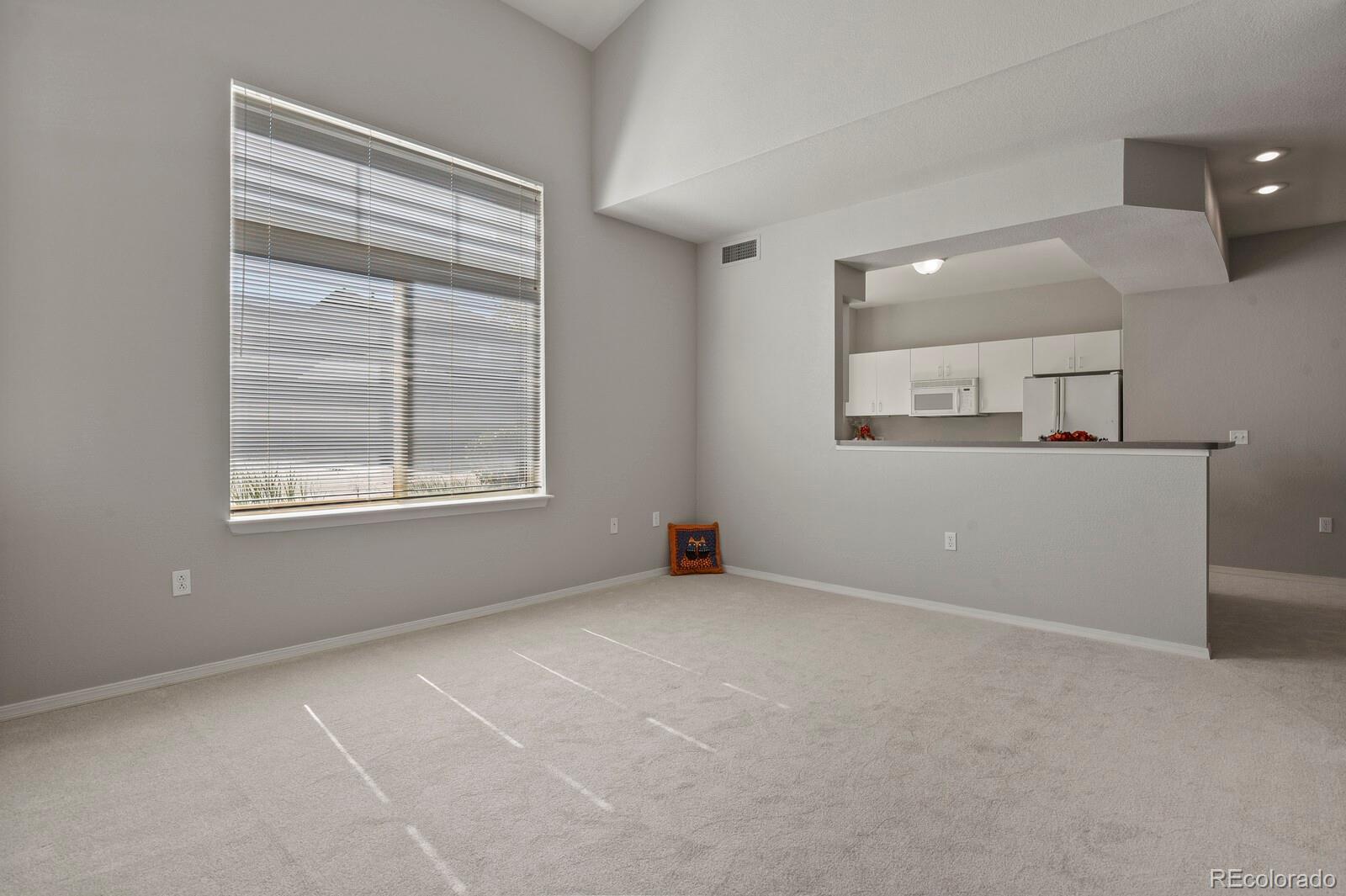 6444 Silver Mesa Drive, Unit A Highlands Ranch, CO 80130 - Photo 4 of 40 an empty room with windows