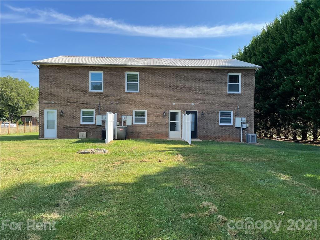 4581 County Home Road, Unit 1 Conover, NC 28613 - Photo 10 of 10 a backyard of a house with a garden and barbeque oven