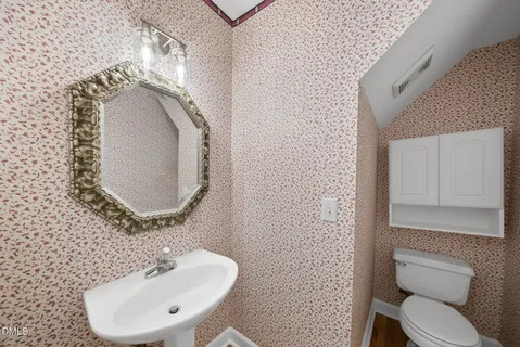 a kitchen with stainless steel appliances white cabinets and a stove a oven with white countertops