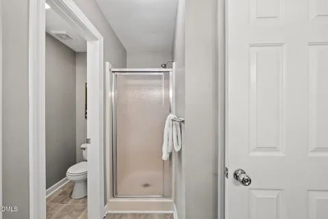 a bathroom with a tub sink and window