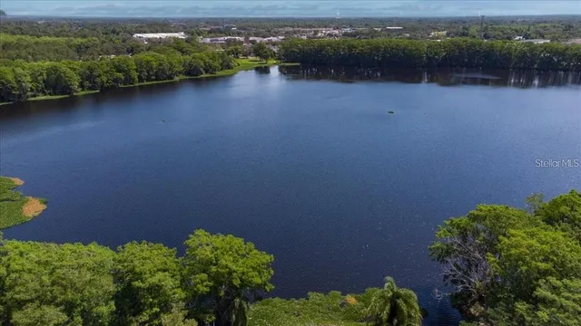 an aerial view of a houses with a lake view