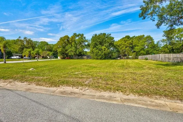 a view of a big yard with an outdoor space