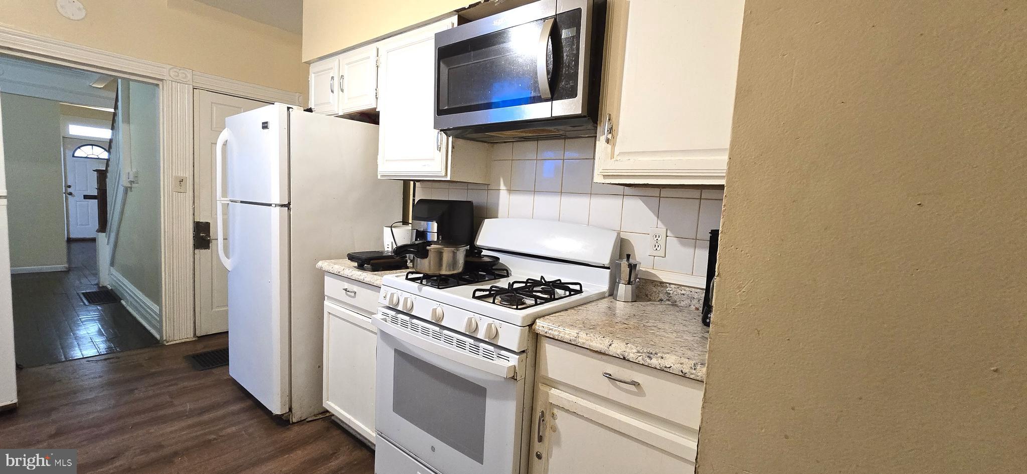 610 South Prince Street Lancaster, PA 17603 - Photo 12 of 52 a kitchen with stainless steel appliances granite countertop a refrigerator and a stove