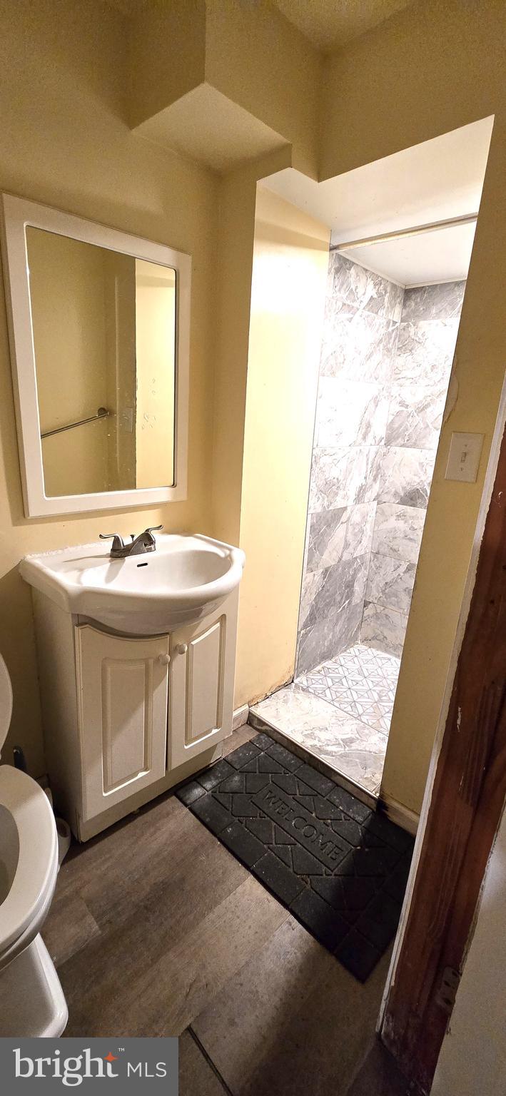 610 South Prince Street Lancaster, PA 17603 - Photo 14 of 52 a bathroom with a sink a toilet and a mirror