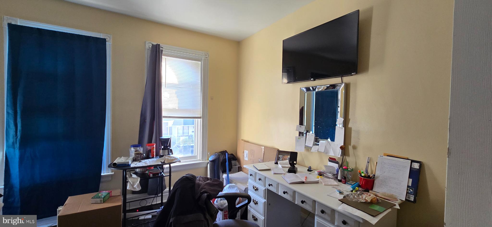 610 South Prince Street Lancaster, PA 17603 - Photo 28 of 52 a view of a workspace with furniture and a flat screen tv