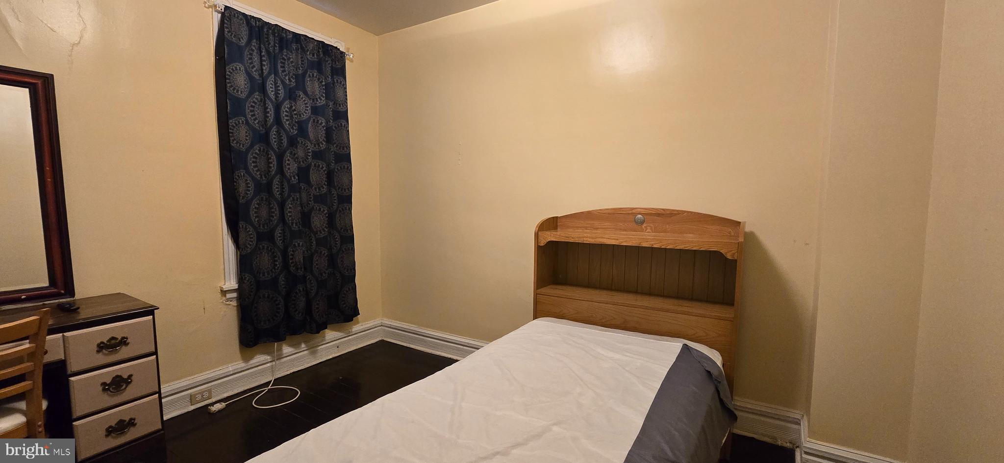 610 South Prince Street Lancaster, PA 17603 - Photo 30 of 52 a bedroom with a bed and a flat tv screen