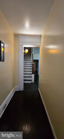 a view of an empty room with stairs