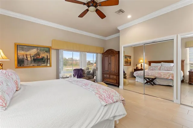 a bedroom with a bed and view of living room