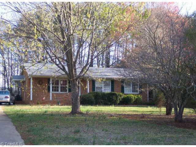 7908 Pate Drive Oak Ridge, NC 27310 - Photo 1 of 9 Exterior Front.