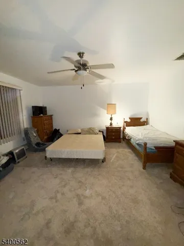a bed room with a bed and furniture
