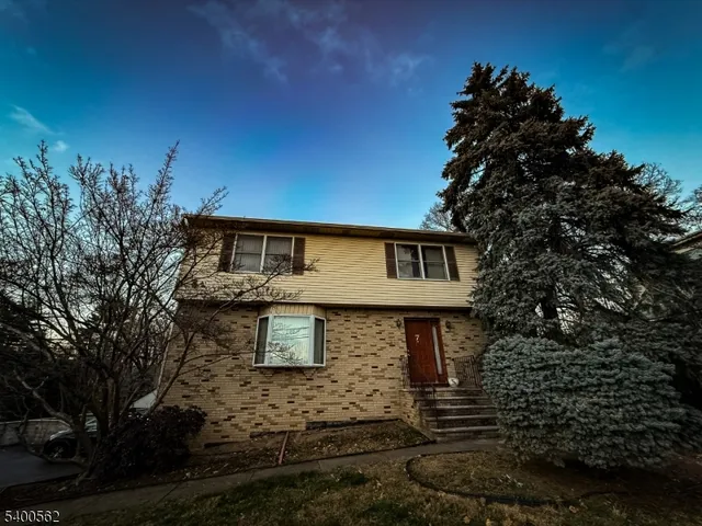 a front view of a house with yard