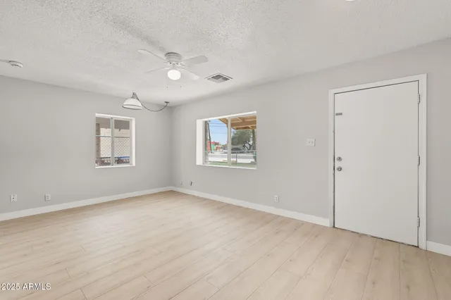 a view of an empty room with a window