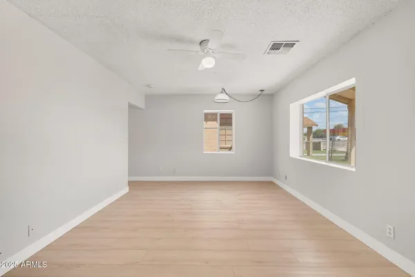 a view of an empty room with a window
