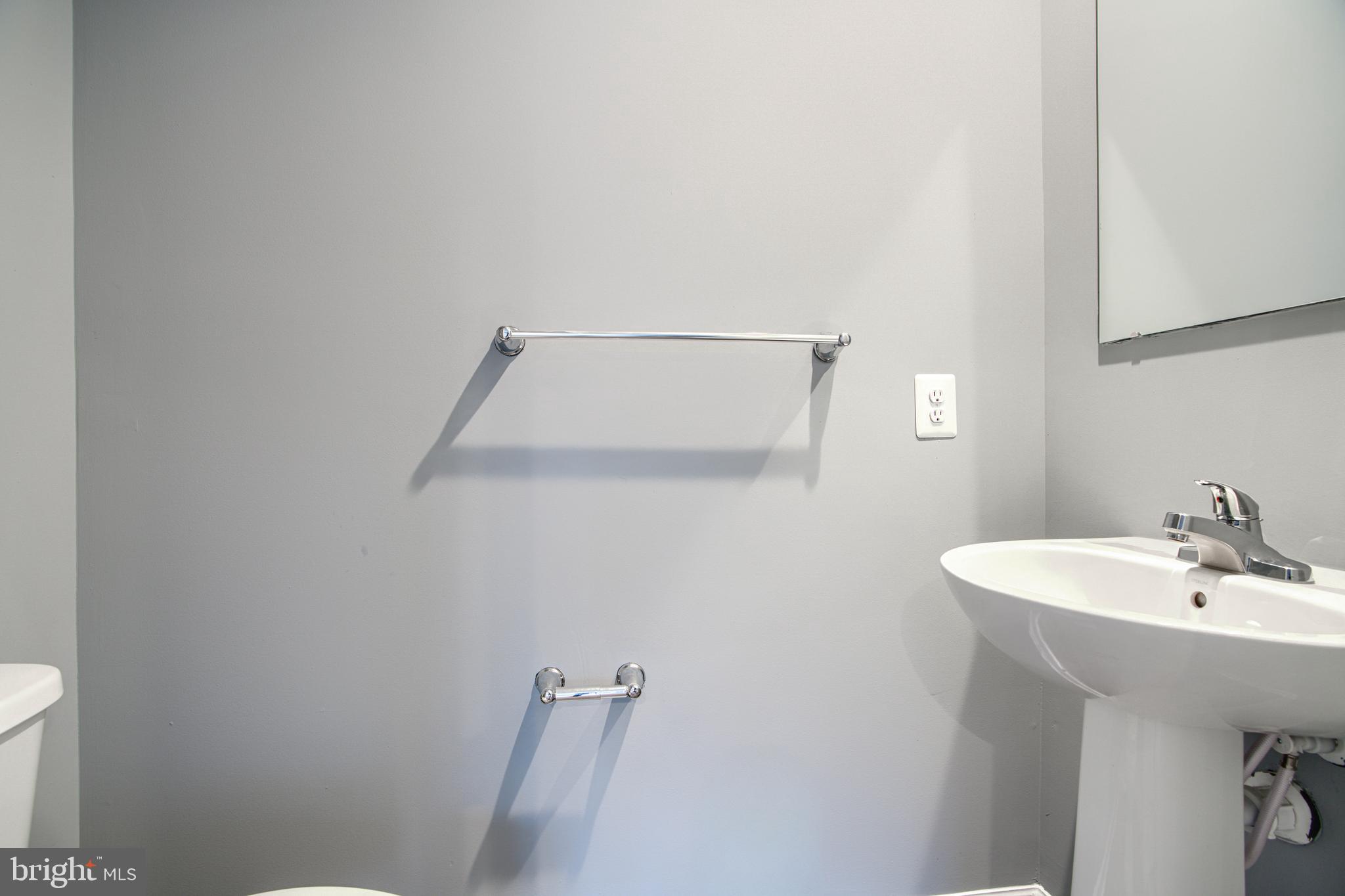 104 Magnolia Drive Elkton, MD 21921 - Photo 16 of 52 a bathroom with a sink a toilet and mirror