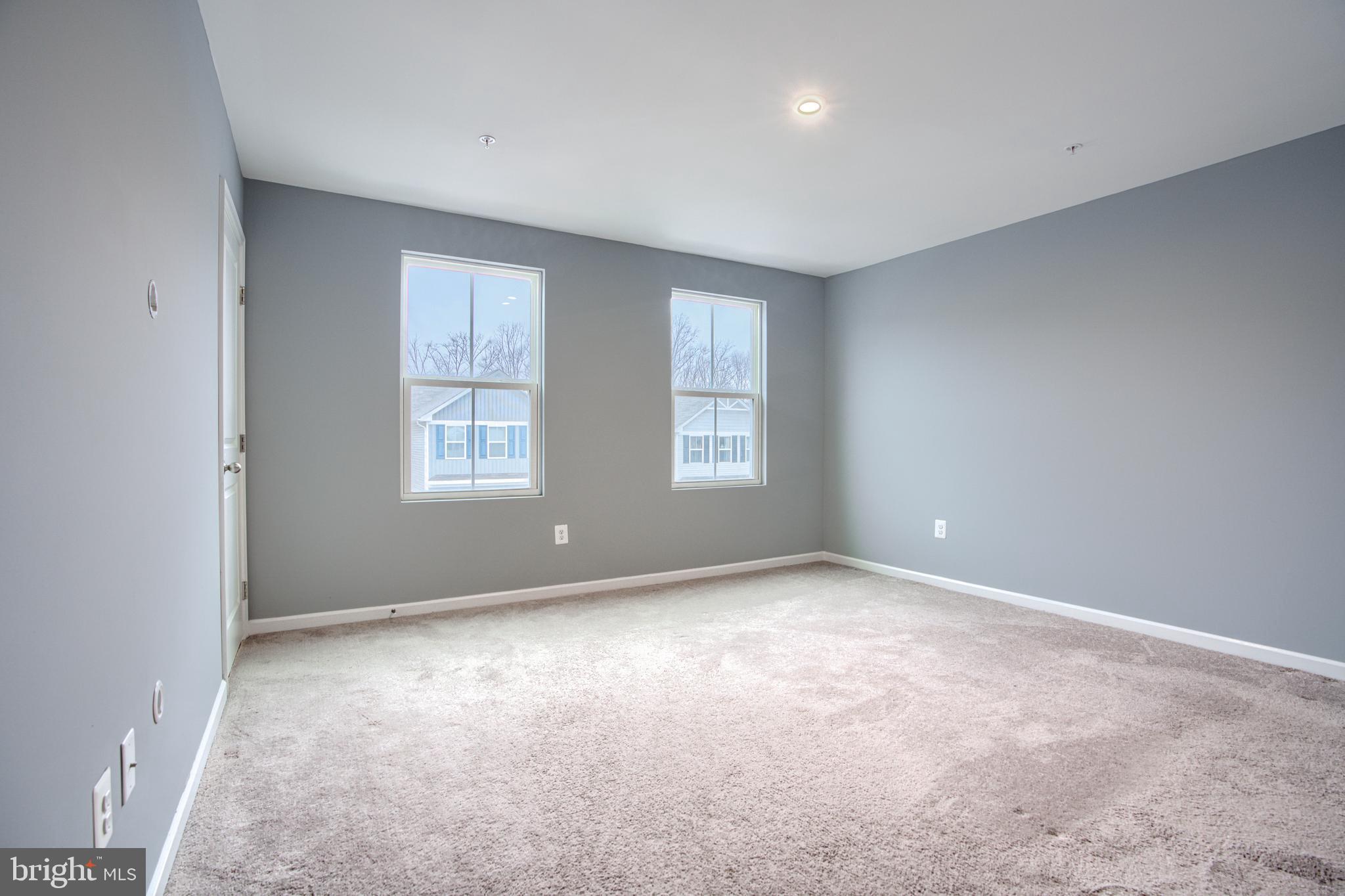 104 Magnolia Drive Elkton, MD 21921 - Photo 17 of 52 an empty room with windows